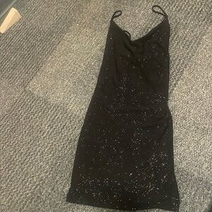 Sparkly black mini dress.